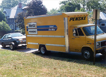 Car hooked up to the moving van