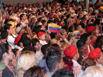 Baby in crowd w/ Venezuelan flag